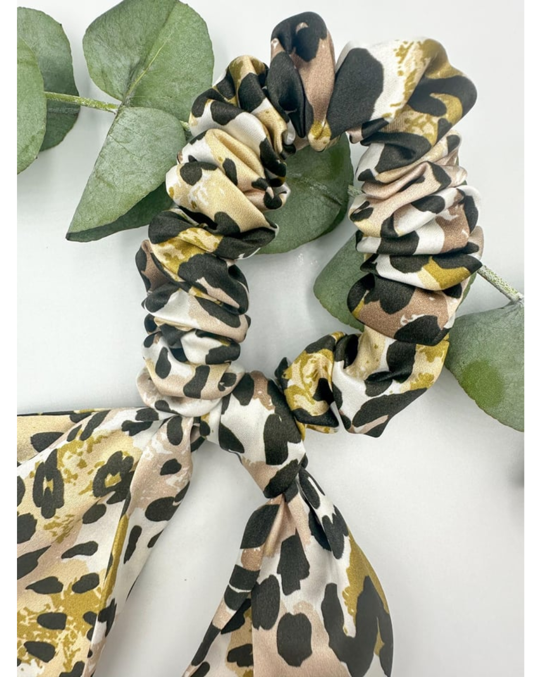 SILK BOW PONYTAIL HOLDER - CORAL LEOPARD PRINT