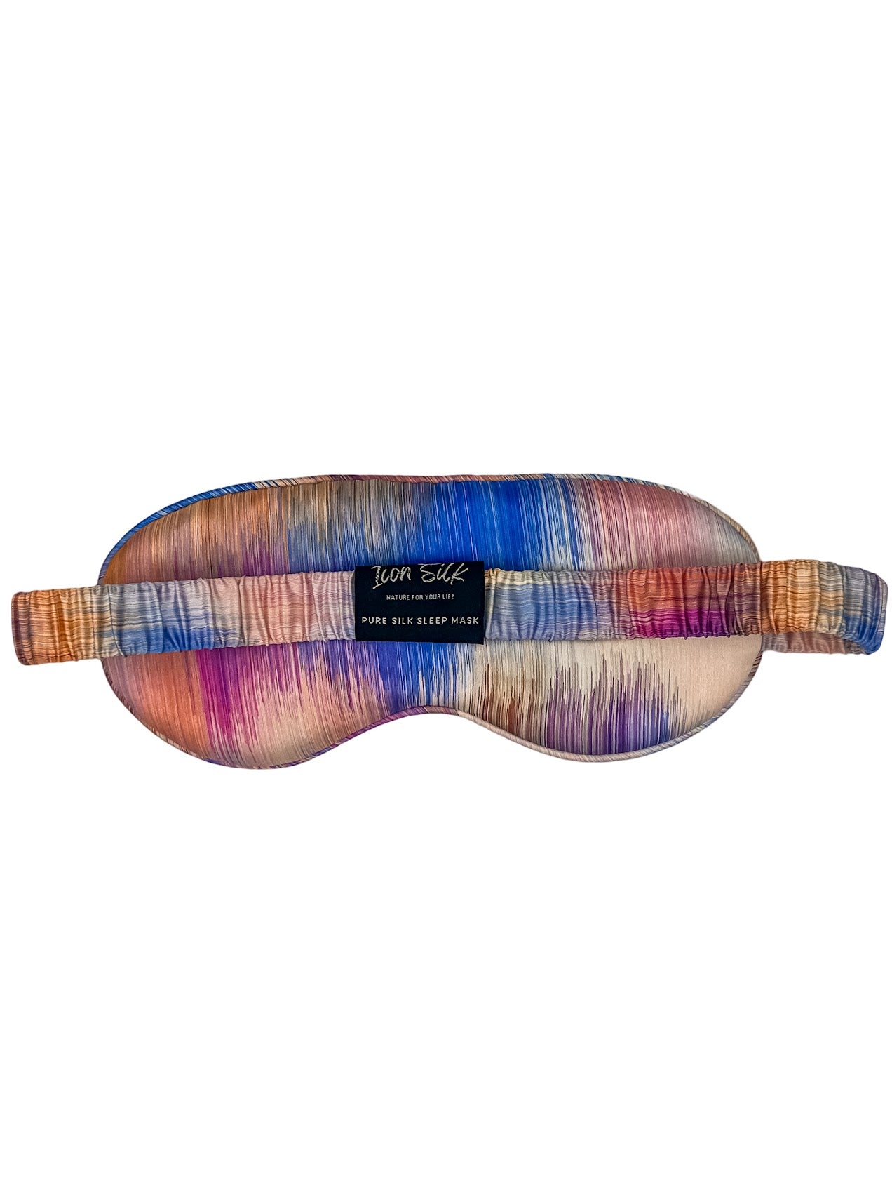 Parte posterior del antifaz para dormir de seda morera con estampado efecto amanecer multicolor, banda elástica y etiqueta Icon Silk sobre fondo blanco