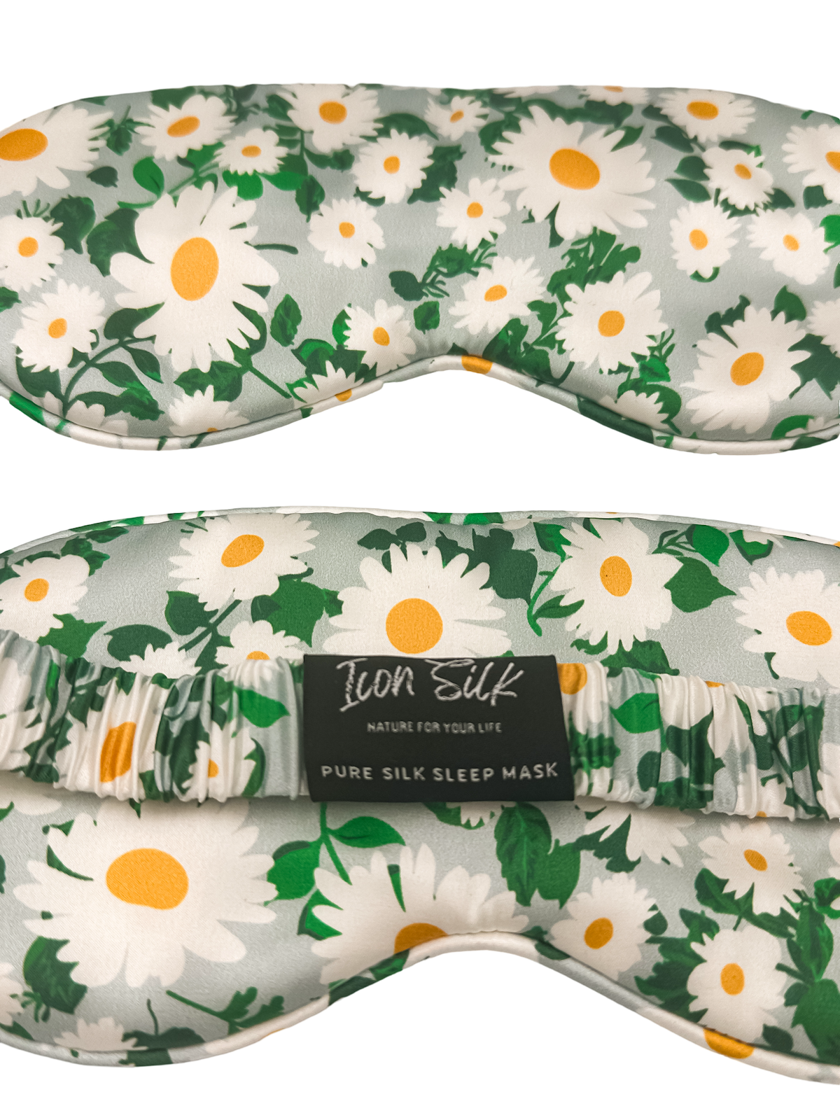 Detalle frontal y trasero del antifaz para dormir de seda morera con estampado de margaritas, banda elástica y etiqueta Icon Silk