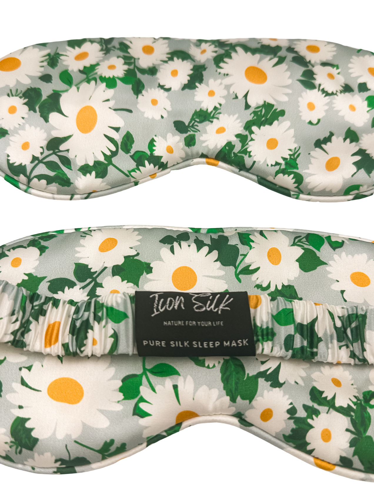 Detalle frontal y trasero del antifaz para dormir de seda morera con estampado de margaritas, banda elástica y etiqueta Icon Silk