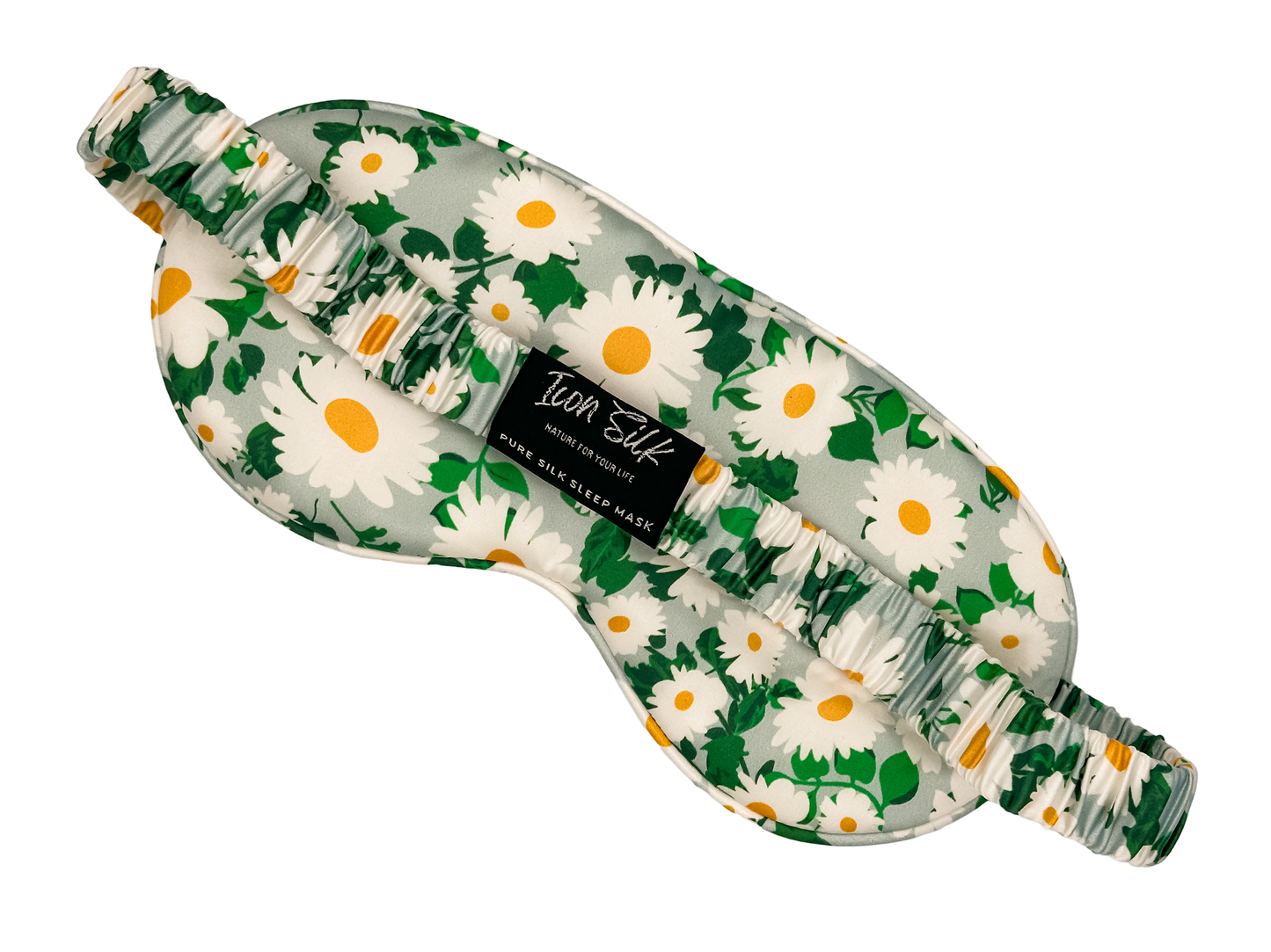Parte posterior del antifaz para dormir de seda morera con estampado de margaritas, banda elástica y etiqueta Icon Silk