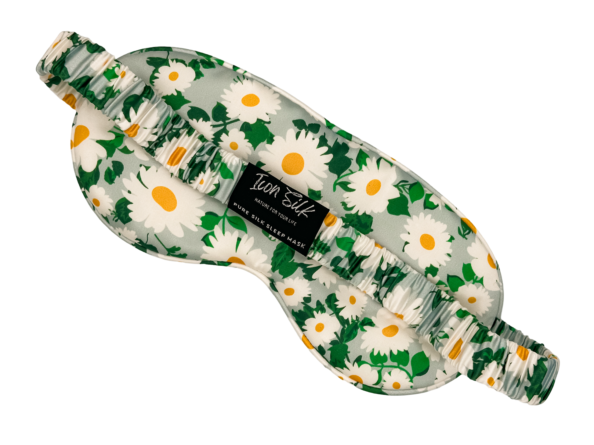 Parte posterior del antifaz para dormir de seda morera con estampado de margaritas, banda elástica y etiqueta Icon Silk