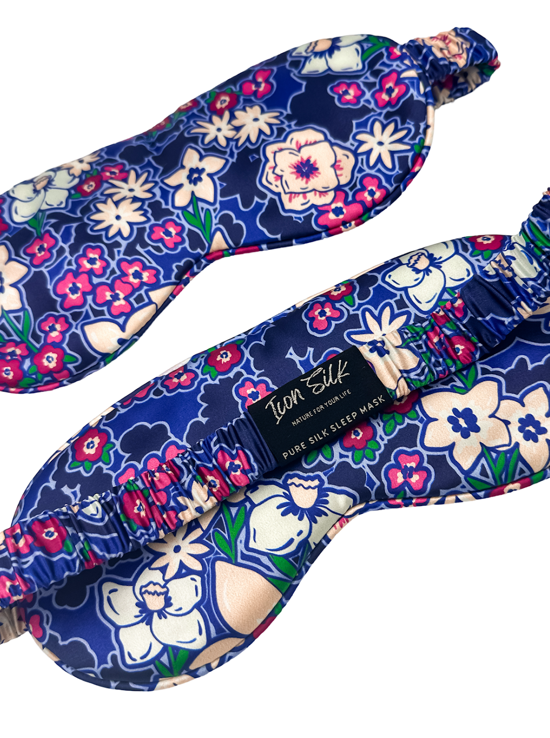 Detalle frontal y trasero del antifaz de seda Jardín Azul con estampado floral y banda elástica revestida de seda