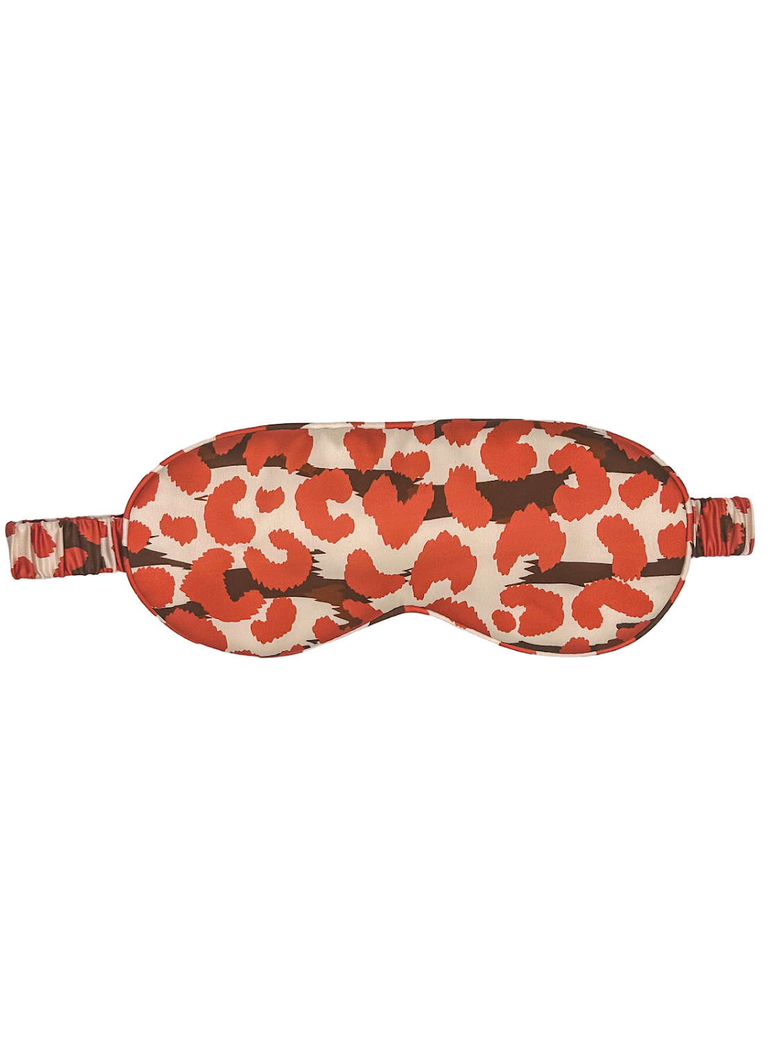 Antifaz para dormir de seda morera con estampado leopardo rojo, visto de frente con banda elástica