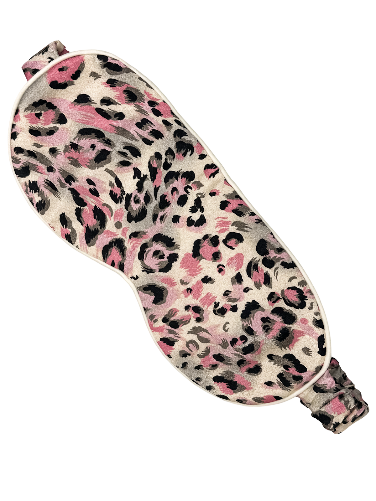 Antifaz para dormir de seda morera Rosa Salvaje con estampado animal rosa, gris y negro visto en diagonal sobre fondo blanco